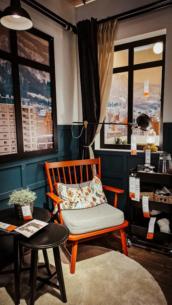 stylish-living-room-setup-with-chair-table-and-mountain-view.-35348456-576x1024