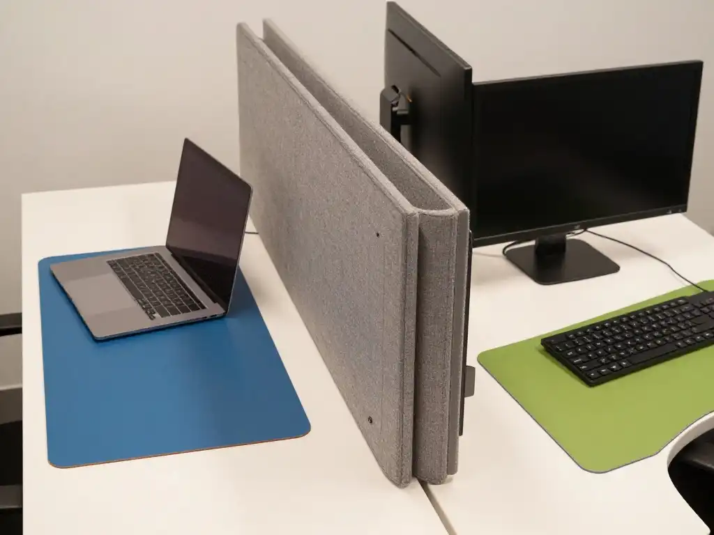 How to Create Visual Separation on a Double Desk Without Building an Actual Wall