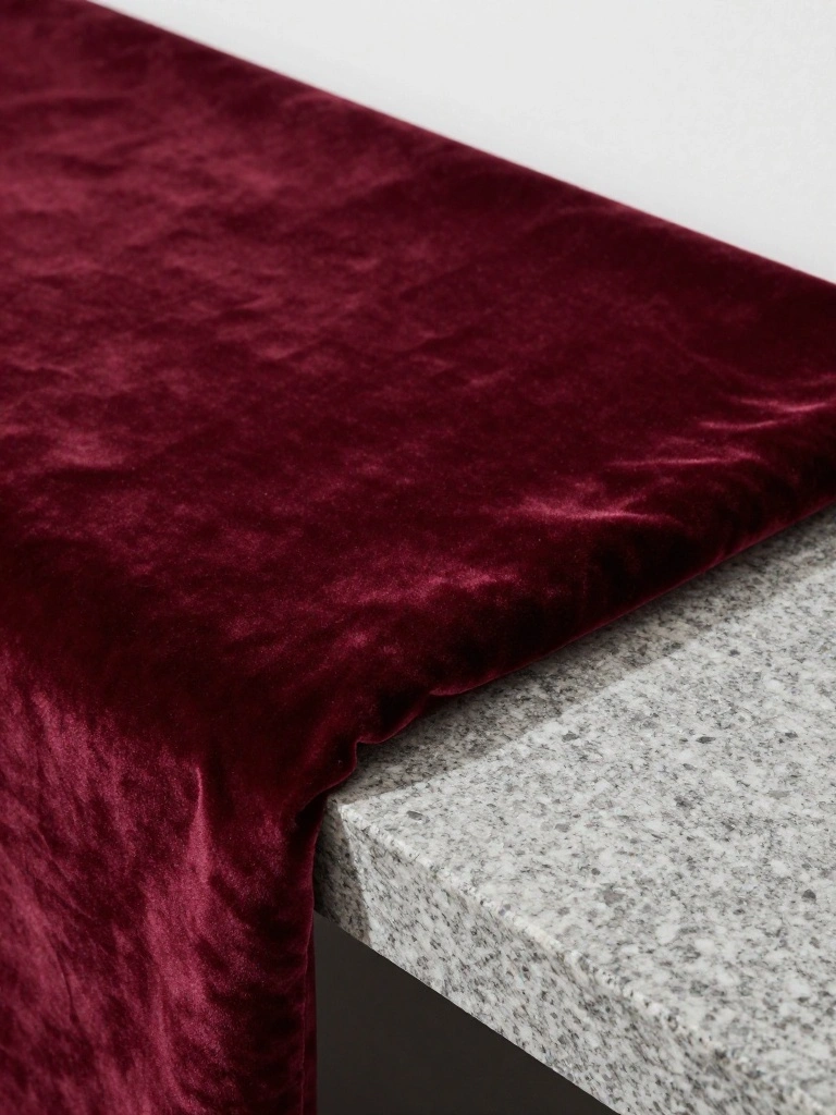 Velvet Cushions Defy the Bleak Landscape Outdoors With Vibrant Depth